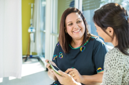 Friendly team member talking to patient