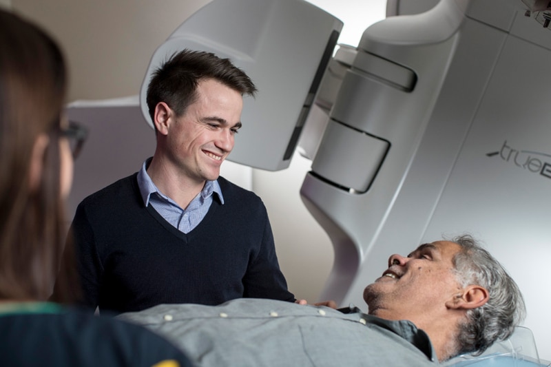 Radiation Oncologist providing radiotherapy to a cancer patient.