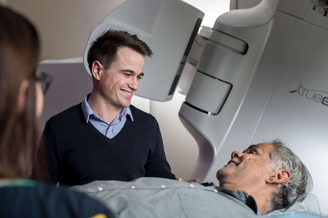 Radiation Oncologist providing radiotherapy to a cancer patient.