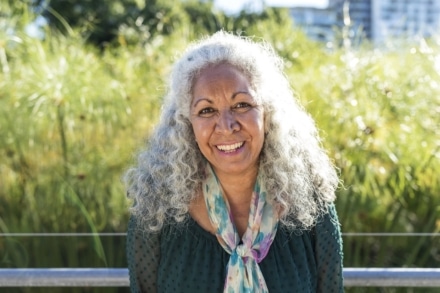 Elderly cancer patient smiling for photograph