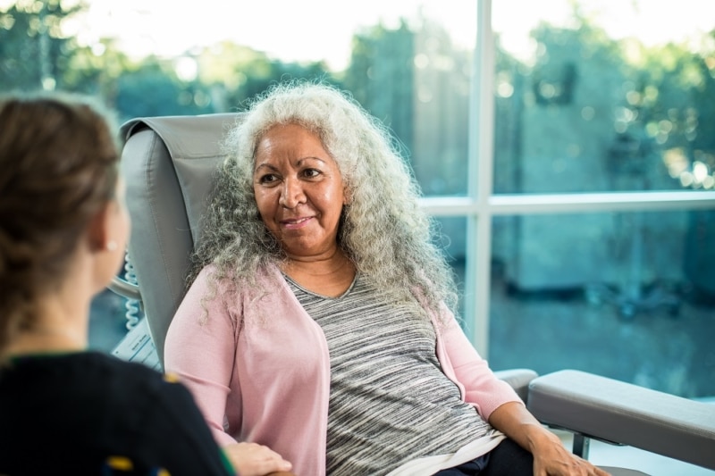 Icon Care team member consulting with cancer patient.