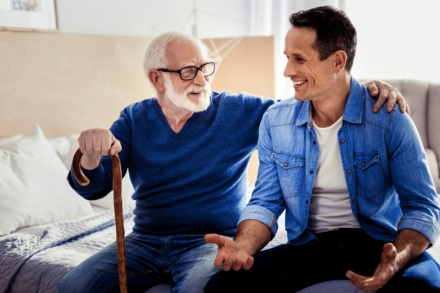 Happy nice man spending time with his father