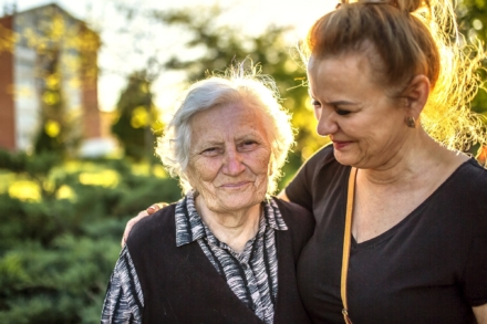 Person caring for an elderly cancer patient