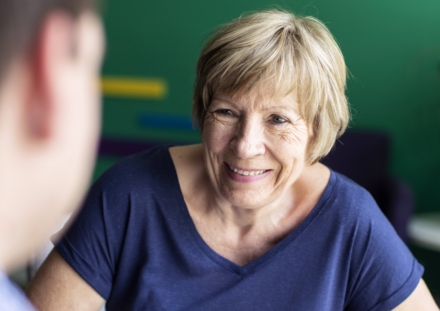 Smiling patient in cancer consultation