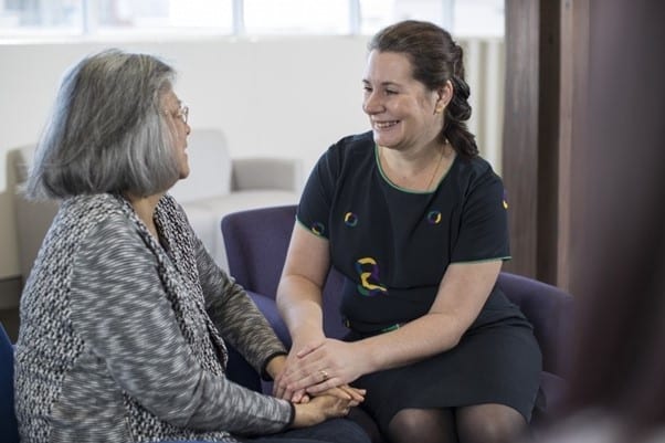 Icon team member comforting cancer patient